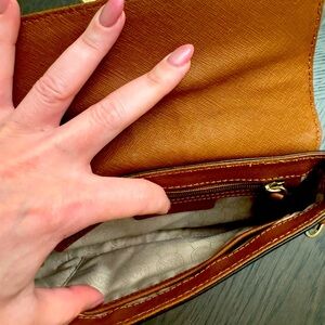 Used good condition purse - a few scratches on front logo